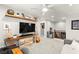 Cozy living room area with mounted TV, decorative shelves, and modern furnishings at 711 Florence Isle Ave, Henderson, NV 89015