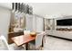 Open-concept living space showcasing a modern chandelier, dining table, and comfortable living room at 711 Florence Isle Ave, Henderson, NV 89015