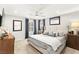 Bedroom featuring plush carpeting, neutral colored walls, a ceiling fan, and large windows at 711 Florence Isle Ave, Henderson, NV 89015