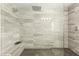 Bright shower with built in bench seating featuring gray tile and glass surround at 711 Florence Isle Ave, Henderson, NV 89015