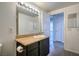 Bathroom featuring a single sink with mirror and vanity and entry to the bedroom at 8000 Badura Ave # 1168, Las Vegas, NV 89113