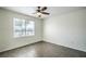 Bedroom featuring wood-look flooring, ceiling fan with light, neutral walls, and a window at 8000 Badura Ave # 1168, Las Vegas, NV 89113