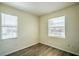 Bedroom with wood-look flooring with 2 windows allowing ample natural light at 8000 Badura Ave # 1168, Las Vegas, NV 89113