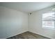 Well-lit bedroom features wood-look floors and a window providing ample natural light at 8000 Badura Ave # 1168, Las Vegas, NV 89113