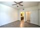Spacious bedroom includes wood floors, ceiling fan, and doorways to a bathroom and closet at 8000 Badura Ave # 1168, Las Vegas, NV 89113