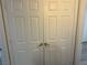 Double doors to closet with golden hardware at 8000 Badura Ave # 1168, Las Vegas, NV 89113