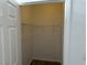 Walk-in closet with shelving, white walls, and wood-look flooring at 8000 Badura Ave # 1168, Las Vegas, NV 89113