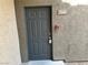 Apartment front door featuring the unit number and a fire alarm, contributing to a safe living environment at 8000 Badura Ave # 1168, Las Vegas, NV 89113