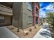 Landscaped condo exterior with walkway, showcasing architectural features and outdoor space at 8000 Badura Ave # 1168, Las Vegas, NV 89113