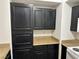 Spacious kitchen cabinet with light countertops and paneled doors at 8000 Badura Ave # 1168, Las Vegas, NV 89113