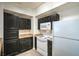 Functional kitchen featuring cabinets, white appliances, and efficient layout at 8000 Badura Ave # 1168, Las Vegas, NV 89113