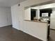 Open kitchen with black cabinets, granite countertops, and white appliances at 8000 Badura Ave # 1168, Las Vegas, NV 89113