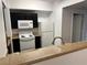 Practical kitchen with granite counter looking toward open room at 8000 Badura Ave # 1168, Las Vegas, NV 89113