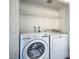 Bright laundry room features a white washer and dryer at 8000 Badura Ave # 1168, Las Vegas, NV 89113