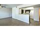 Open living space with modern flooring, seamlessly connecting to the kitchen area at 8000 Badura Ave # 1168, Las Vegas, NV 89113