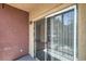 Exterior shot from patio, looking into the living room with sliding glass doors at 8000 Badura Ave # 1168, Las Vegas, NV 89113