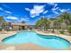A community swimming pool with ample lounge chairs and secure fencing at 8000 Badura Ave # 1168, Las Vegas, NV 89113