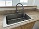 Stainless steel sink with granite countertops and modern faucet at 8000 Badura Ave # 1168, Las Vegas, NV 89113