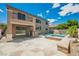 Wonderful backyard with pool, spa, and an outdoor kitchen at 8244 Cupertino Heights Way, Las Vegas, NV 89178