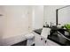 Bathroom featuring a black marble countertop with a dark hardwood floor at 8244 Cupertino Heights Way, Las Vegas, NV 89178