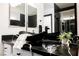 Close-up of a bathroom vanity with a modern vessel sink and stylish fixtures at 8244 Cupertino Heights Way, Las Vegas, NV 89178