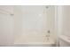 Bright bathroom with a white tile surround shower with an overhead shower head at 8244 Cupertino Heights Way, Las Vegas, NV 89178