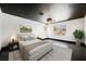 Staged bedroom featuring modern lighting, carpet, and large windows at 8244 Cupertino Heights Way, Las Vegas, NV 89178