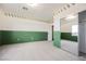 Green and white bedroom with carpeted floors and sliding mirrored closet at 8244 Cupertino Heights Way, Las Vegas, NV 89178