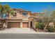 Charming two-story home featuring a three-car garage, desert landscaping, and a tile roof at 8244 Cupertino Heights Way, Las Vegas, NV 89178