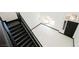 Bright foyer featuring high ceilings, a striking staircase, and modern black accents at 8244 Cupertino Heights Way, Las Vegas, NV 89178