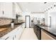 Well-equipped kitchen with granite countertops, stainless steel appliances, and ample cabinet space at 8244 Cupertino Heights Way, Las Vegas, NV 89178