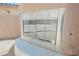 Outdoor fireplace with glass enclosure and stone surround; gravel floor at 8244 Cupertino Heights Way, Las Vegas, NV 89178
