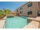 Relaxing backyard pool and spa with a stone surround, perfect for outdoor entertaining and leisure at 8244 Cupertino Heights Way, Las Vegas, NV 89178