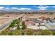 Wide shot of residences surrounded by desert landscape and mountain views and outdoor living spaces at 9180 Mohawk St, Las Vegas, NV 89139