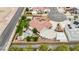 Aerial view of an enclosed property featuring lush landscaping, stone patio, gazebo, and a spacious driveway at 9180 Mohawk St, Las Vegas, NV 89139