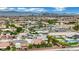 Neighborhood aerial view featuring mature landscaping, red tile roofs, and multiple residences in a planned community at 9180 Mohawk St, Las Vegas, NV 89139