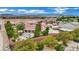 Landscaped backyard featuring a covered patio, seating area, lush landscaping, and beautiful mountain views at 9180 Mohawk St, Las Vegas, NV 89139