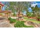 Backyard oasis featuring a covered patio, outdoor dining area, and a tranquil garden at 9180 Mohawk St, Las Vegas, NV 89139