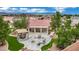 Relaxing outdoor patio area with seating, fire pit, gazebo, and lush landscaping for entertaining and enjoying nature at 9180 Mohawk St, Las Vegas, NV 89139