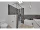 Modern bathroom with walk-in shower, soaking tub, and sleek fixtures under a skylight at 9180 Mohawk St, Las Vegas, NV 89139