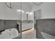 Modern bathroom with walk-in shower, soaking tub, and dual vanity with sleek fixtures at 9180 Mohawk St, Las Vegas, NV 89139