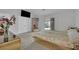 Bedroom featuring a mirrored wardrobe, neutral carpeting, and access to the backyard at 9180 Mohawk St, Las Vegas, NV 89139