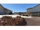 Property featuring a spacious driveway with rock wall, and an additional parking area perfect for a boat or RV at 9180 Mohawk St, Las Vegas, NV 89139