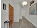 Welcoming entryway features wood-look flooring and decorative lighting at 9180 Mohawk St, Las Vegas, NV 89139