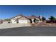 Charming single story home with a three car garage, well manicured landscape, and a tile roof at 9180 Mohawk St, Las Vegas, NV 89139