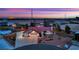 Charming single-story home with three-car garage, beautiful landscaping, and a mini-golf course in the front yard at 9180 Mohawk St, Las Vegas, NV 89139
