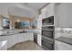 Elegant kitchen with white cabinetry, stainless steel appliances, and modern backsplash for a sleek design at 9180 Mohawk St, Las Vegas, NV 89139