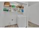 Laundry room boasts washer, storage shelves, and tile flooring at 9180 Mohawk St, Las Vegas, NV 89139
