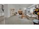 Cozy living room with a fireplace, plush seating, and ample natural light from the large window at 9180 Mohawk St, Las Vegas, NV 89139