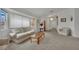 Inviting living room with neutral colors, comfortable sofa, and large window for plenty of natural light at 9180 Mohawk St, Las Vegas, NV 89139